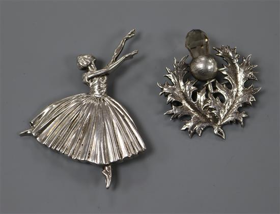 A 1930s Scottish silver and gem set thistle brooch and a 1940s silver ballerina brooch, largest 68mm.